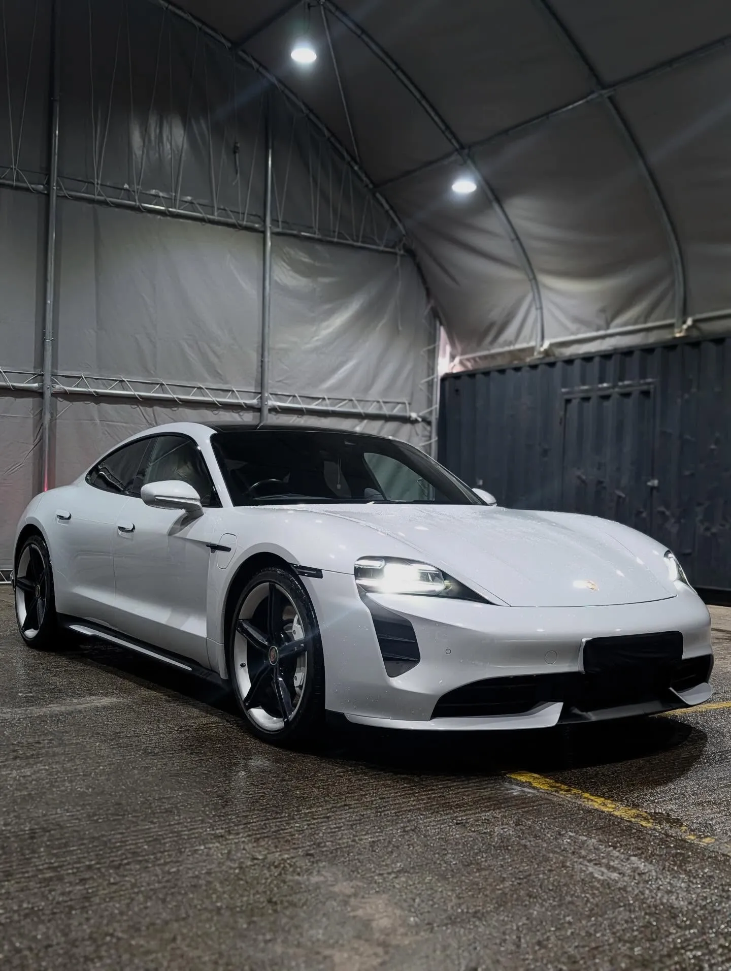 White luxury car stored in secure indoor facility