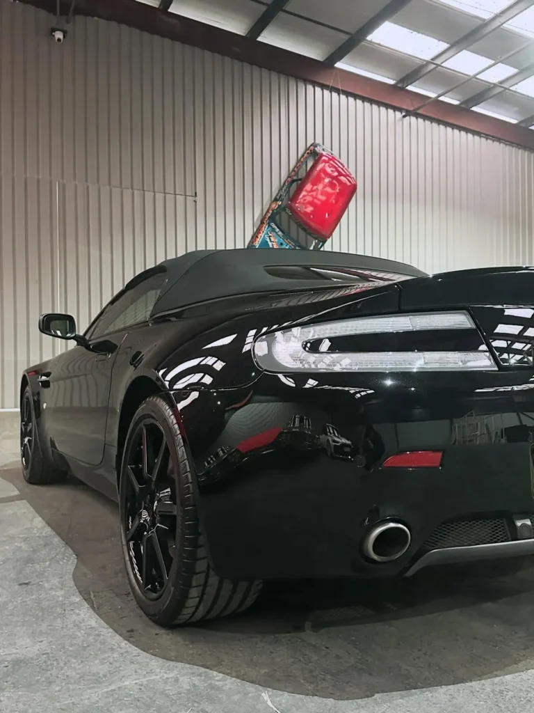Black aston martan store in care storage