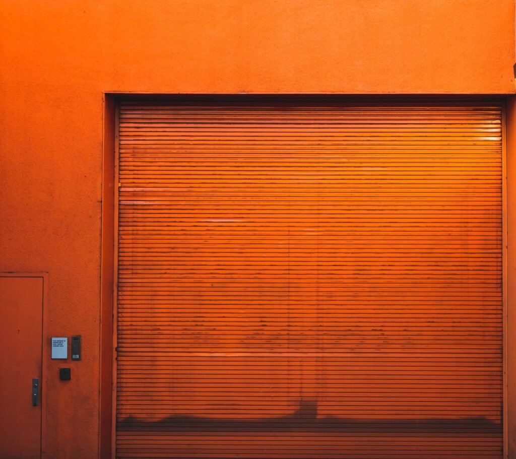 Closed roller door on a drive-up self-storage unit, the kind rented as a car storage unit